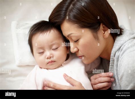 Baby Boy And Mother Sleeping Stock Photo Alamy