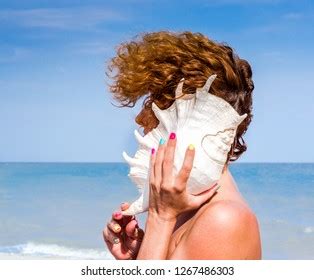 Стоковая фотография 2415840823 Naked Girl Sand Big Oceanic Seashell Shutterstock