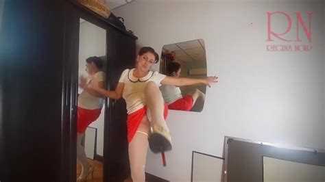 A Naked Lady Does Make Up In Front Of A Mirror Puts On Underwear Stockings A Skirt