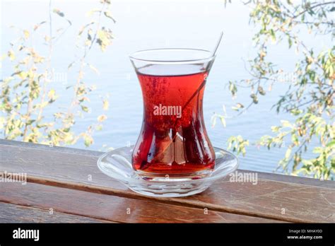 Drinking tea against the sea Stock Photo - Alamy