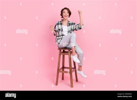 Full Body Photo Of Cool Millennial Brunette Lady Sit Wear Shirt Trousers Isolated On Pink