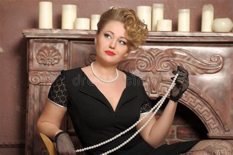 Stylish Blonde In A Black Dress With A Pearl Necklace Stock Photo Image Of Female Background