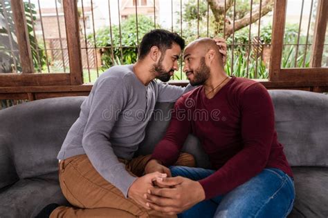 Gay Couple Enjoying The Company Of Each Other In The Couch Stock Photo Image Of Enjoying