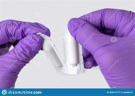 Doctor Hand In Surgical Gloves Holding Detach One Anal Or Vaginal Rectal Suppositories Anti