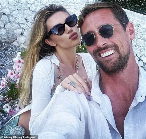 Abbey Clancy Flaunts Her Toned Physique In A Skimpy String Bikini As She Enjoys A Sun Soaked