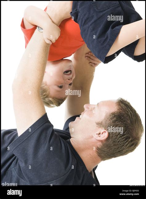 Parents Holding Kids Upside Down Hi Res Stock Photography And Images