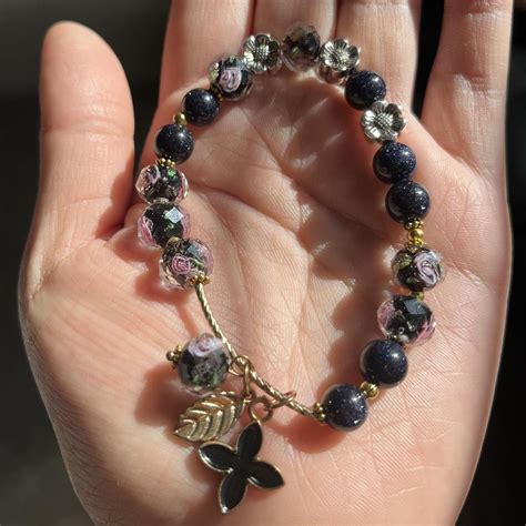 Black Beed Bracelet With Flowers With Charm Depop