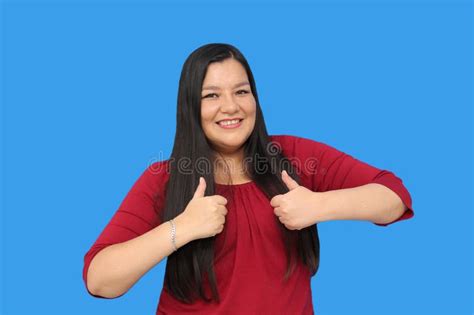 Year Old Latina Woman Points To Something That She Likes Surprises And Excites Such As