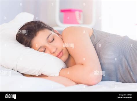Beautiful Brunette Lying On Bed Sleeping Stock Photo Alamy