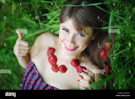 Beautiful Brunette Girl With Strawberry Stock Photo Alamy