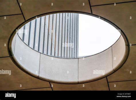 Close Up Of Circular Skylight With View Of The Concrete Building