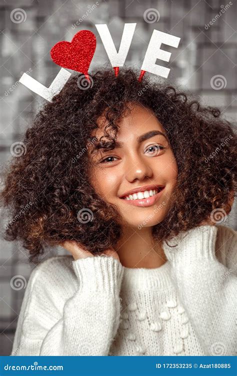 Close Up Portrait Of A Young Beautiful Curly Haired Girl With A Rim