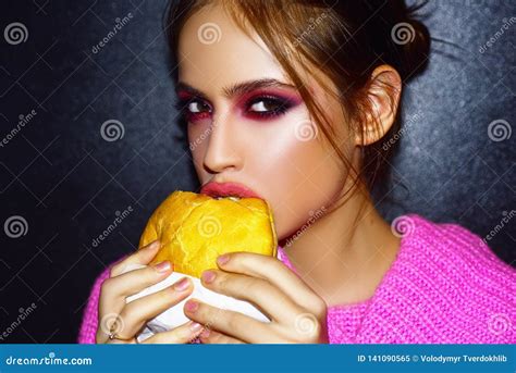 Woman Eats A Burger Food Food Porn Teen Girls Enjoying Delicious Burgers In Cafe Stock Image