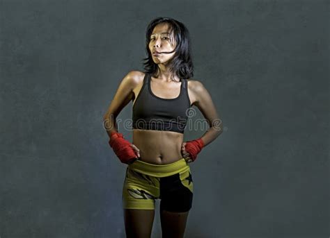 Portrait Of Sporty And Fit Fighter Asian Chinese Woman Using Wrist