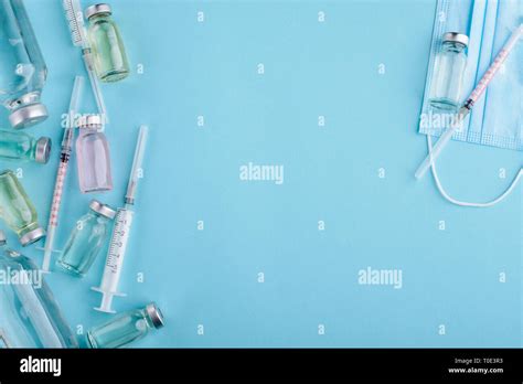 Vials Syringes And Mask Stock Photo Alamy