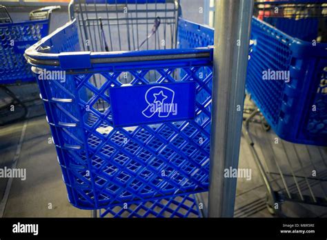 The Toys R Us logo on a shopping cart at their store in a strip mall in ...