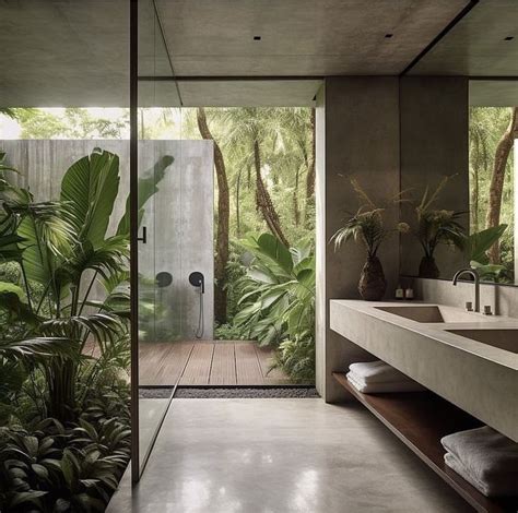 A Modern Bathroom With Large Plants In The Shower