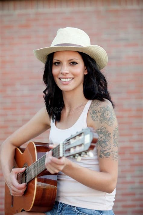 Brunette Pretty Woman Playing A Guitar Stock Photo Image Of