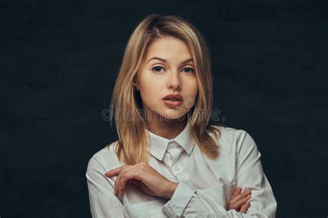 Portrait Of A Sensual Blonde Girl Dressed In A White Shirt Posing In A