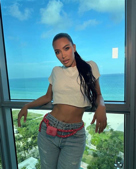 Kim Kardashian Nearly Topples Right Out Of Tiny Black Bikini Top As She Smolders Under Hot