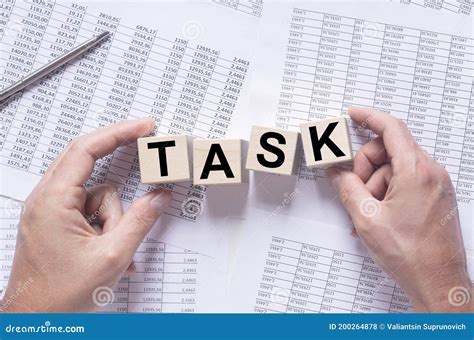 Word Task On Wooden Cubes On Financial Documents Stock Photo Image Of