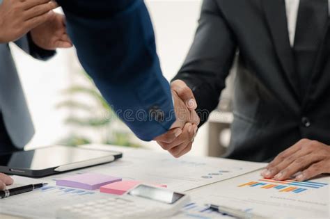 Two Businessmen Holding Hands Two Businessmen Are Agreeing On Business