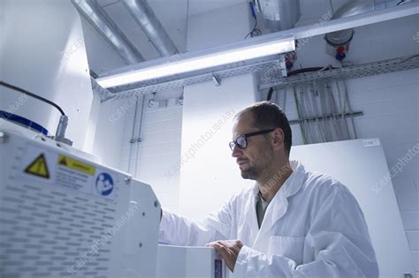 Lab Assistant Working On Equipment Stock Image F011 9300 Science