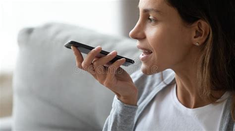 Close Up Smiling Woman Recording Voice Message Holding Phone Stock