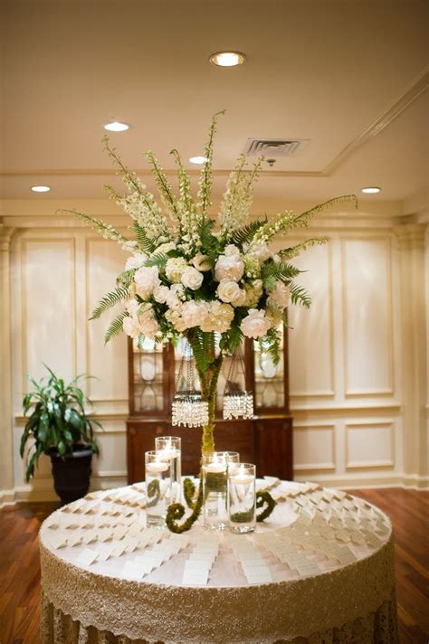 Tall Flower Arrangement With Ivory Roses And Delphiniums Wedding Reception Centerpieces