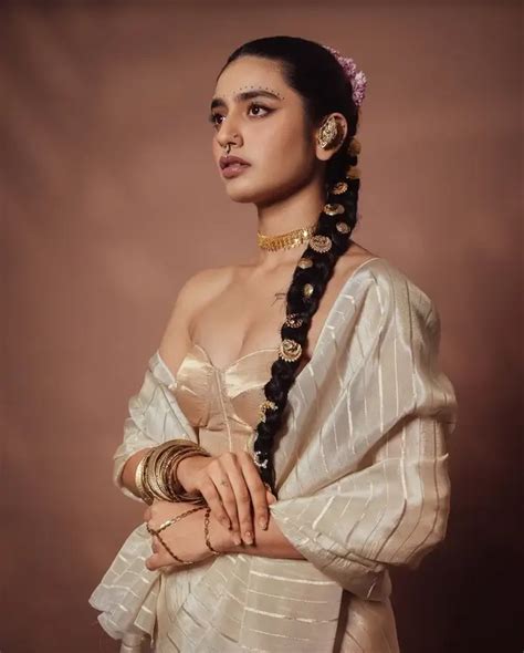 Hot Priya Prakash Shows Off Big Boobs And Deep Cleavage In A Cream Colored Silk Saree