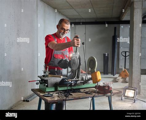 Mature Plumber Cutting Plastic Pipe Stock Photo Alamy