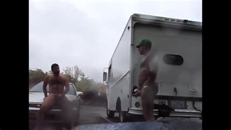 Public Rainy Stroking In A Parking Lot By Two Horny Men