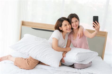 Lesbian Couple Asia Embracing In The Bed Play Phone Happily Stock Image Image Of Bedroom