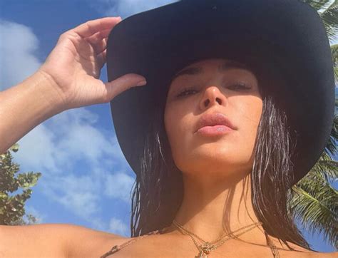 Kim Kardashian Rocks Tiny Bikini And Cowboy Hat Showing Off Her Assets