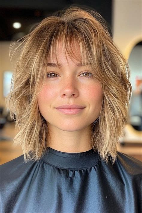 Cute Haircuts For Round Faces Shoulder Length Brunette Bob With Wispy Bangs In