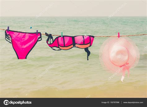 Retro Pink Bikini And Vintage Pink Hat Hanging On Rope Against T Stock Photo Sasilsolution
