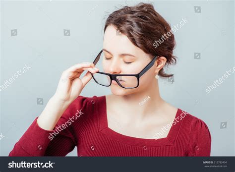 Woman Taking Off Her Glasses Stock Photo Shutterstock