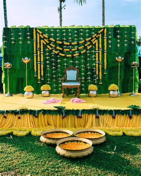 Eco Friendly And Traditional Haldi Setup With Banana Leaves And Flowers