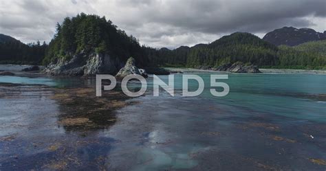 Coastal Alaska Seaweed Swells and Sea Stacks Lateral Aerial Stock