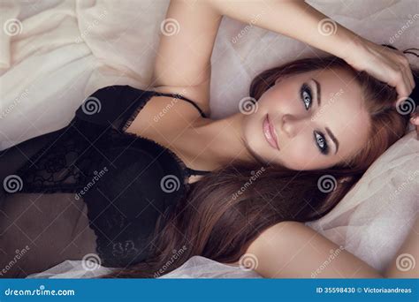 Fashion Portrait Of Beautiful Brunette Woman On Bed Stock Photo Image Of Lovely Hair