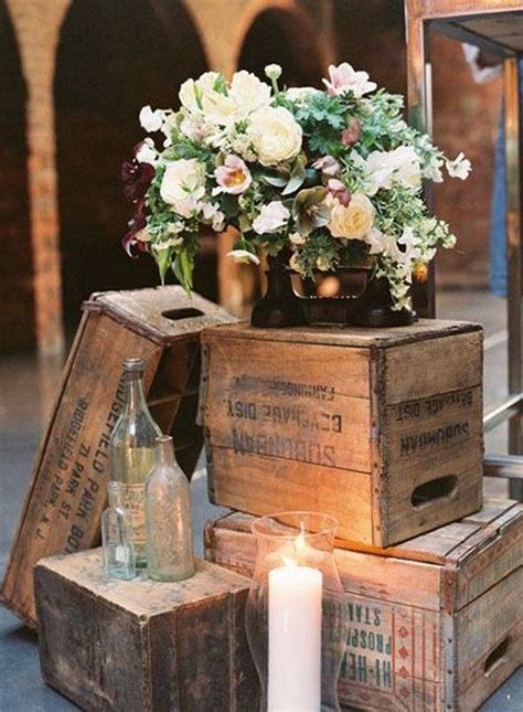 An Image Of Some Boxes With Flowers In Them And Candles On The Table