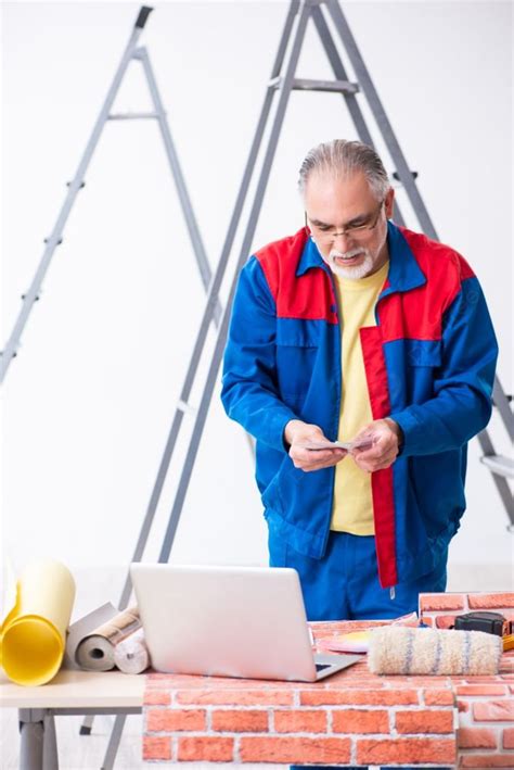 The Old Contractor Doing Renovation At Home Old Contractor Doing