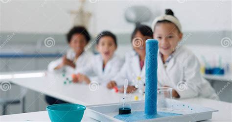 Science Experiment And Chemical Reaction With Kids In A Classroom At