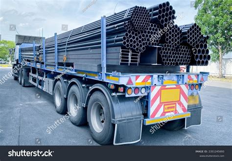 truck transporting pipes images stock   objects