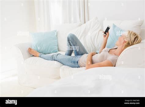 Smiling Blonde Woman Using Her Mobile Stock Photo Alamy