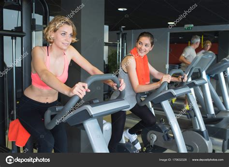 Women training on running machine in gym — Stock Photo © photography33 ...