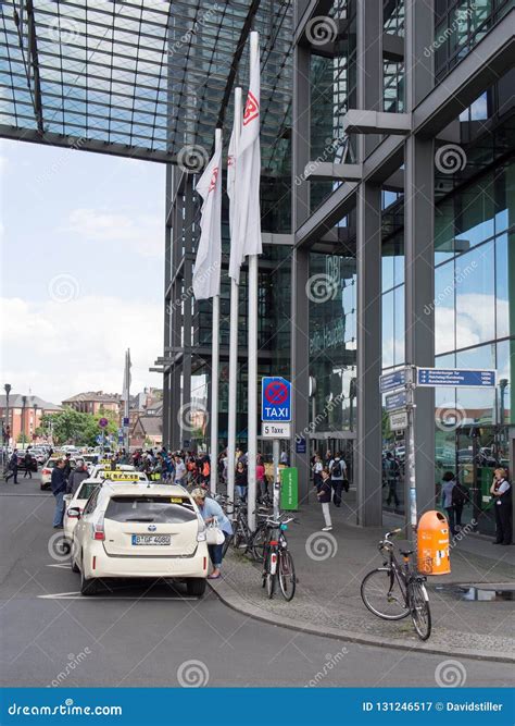 Taxis and Travelers Waiting at the Entrance of Berlin Hauptbahnhof