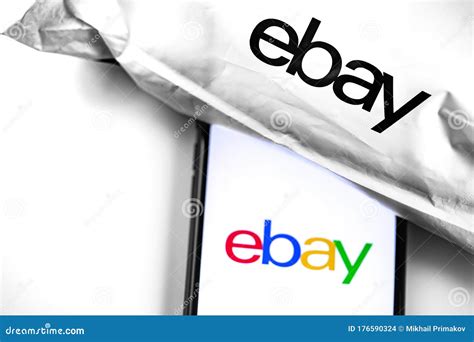 Ebay Logo On The Screen Smartphone And Ebay Plastic Bag Editorial