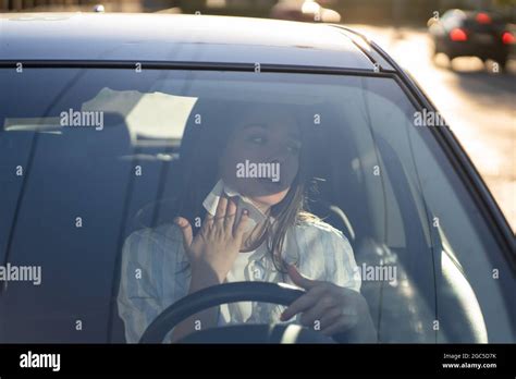 Woman Driver Being Hot During Heat Wave In Car Suffering From Hot Weather Wipes Sweat From Neck