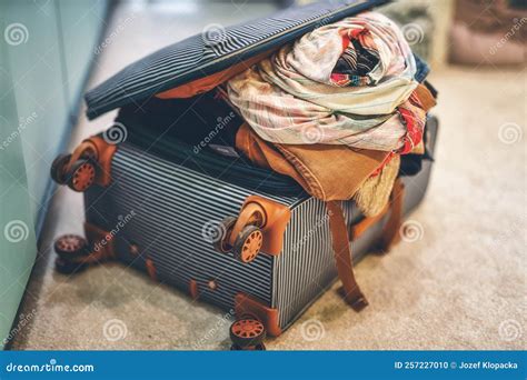 Open Suitcase Full of Clothes in Room. Stock Photo - Image of full ...